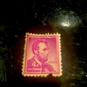 1960 Lincoln 4 cent unused stamp in good condition. Only missing small section.